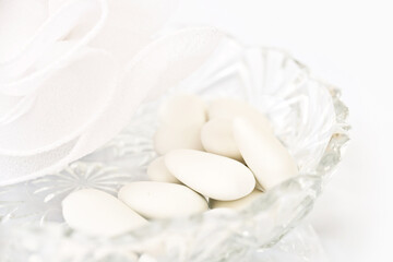 Fototapeta na wymiar White dragees close up. Traditional french candies served at a wedding or a baptism