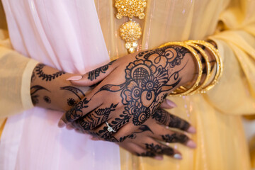 Black Muslim bride showing henna and ring