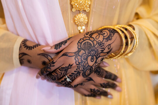 Black Muslim bride showing henna and ring