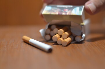An up close view of a package of several cigarettes