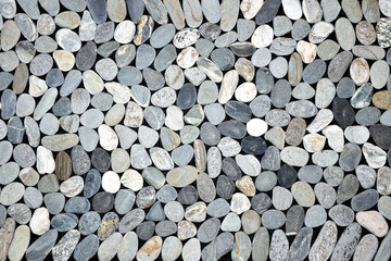 Round pebbles mosaic, grey stones background