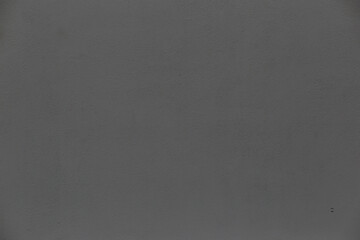 horizontal textural background of a gray cement wall