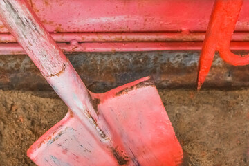 Old fire red box with a shovel and hook and tools to help during a dangerous situation