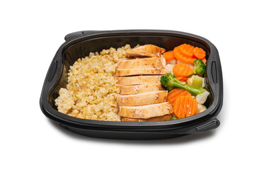 Ready food in a container. Stewed chicken, stewed carrot, cabbage and porridge.