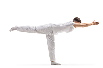 Man practicing a stretching yoga pose