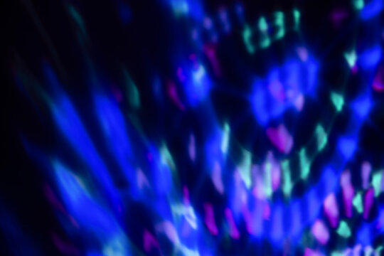 Blur colorful neon light leaks on black background. Defocused illuminated abstract futuristic texture for using over photos as overlay or screen filter © Aleksandra Konoplya