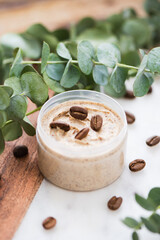 Natural body coffee scrub on marble background