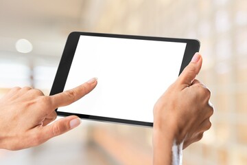 Human hands holding digital tablet with a white blank screen