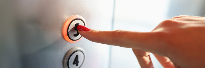 Womans hand pressing button of elevator to fifth floor close-up - obrazy, fototapety, plakaty