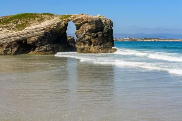 Fotobehang Stone arch on the beach of the cathedrals, famous place in Galicia Spain. © josemiguelsangar