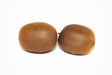 Slice of kiwi and whole kiwi on a white isolated background