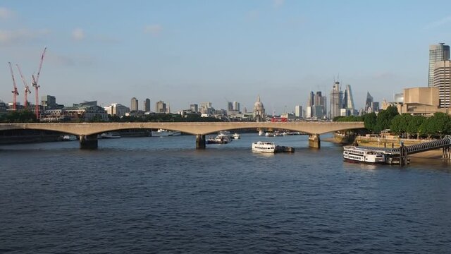 LONDON, UK - CIRCA JUNE 2018: View of Waterloo bridge over river thames and the City skyline at sunset