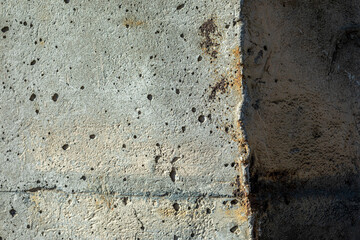 Close-up photo of a concrete hexagonal column. Pores on the concrete surface.