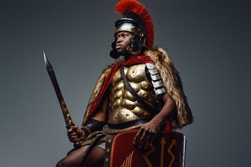 Roman warrior with pelt wielding sword and shield