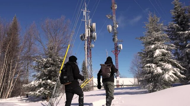 Adventurous video showing two young documentarians looking at the marvels of cellular signals towers, situated in a snow capped hilltop.