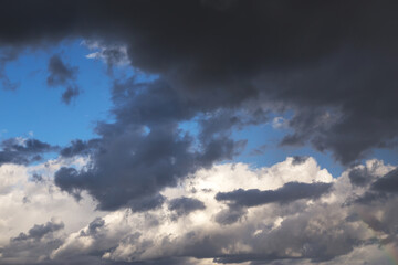 Epic Dramatic Storm sky, dark gray fluffy cumulus clouds background texture, thunderstorm