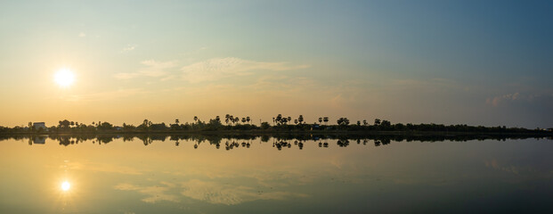 Naklejka premium Evening atmosphere sunset over the river