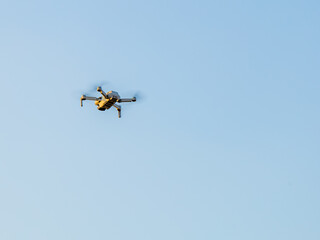 Drone Flying with action camera. Isolated on Sky Background.
