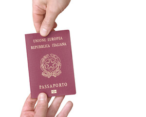 Italian biometric passport of the European Union held between two hands isolated on a white background