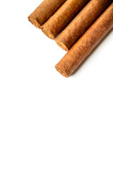 Group of brown cuban cigars isolated on white