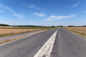 Fototapeta na wymiar Country road in Ile-De-France region. Moigny-sur-École village