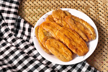 Dried banana on white dish - Fabric background