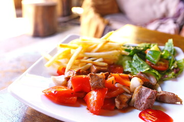 Stir fried beefs and side dishes on dish