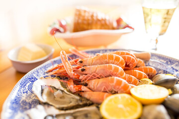 Seafood (langoustines, oysters and clams) on plate