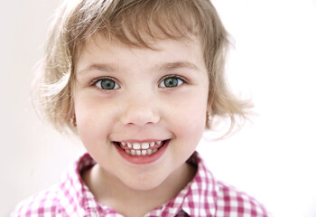 Child girl smiling face closeup.Toddler portrait. Nice happy kid.