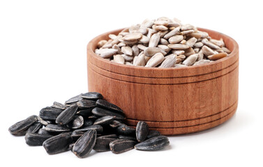 Seeds peeled in a plate and not peeled on a white background. Isolated
