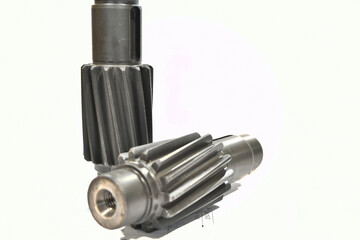 A cogwheel made on a gear cutting machine lies on the technical drawings.