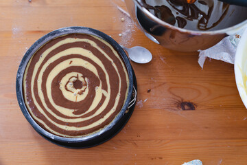 Marble sponge cake elaboration process. Top view. Pastry shop.