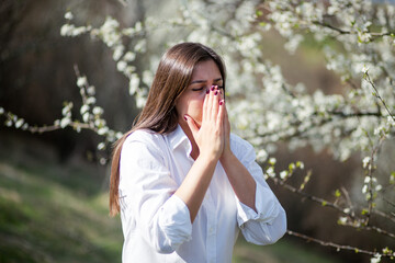 Young women have problem with allergy at spring time