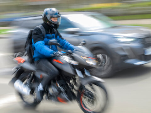 Blurred image of a motorcyclist