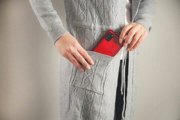 woman hand phone in pocket
