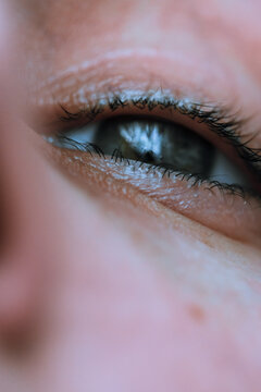 Vertical Closeup Shot Of A Teary Eye Of A Woman