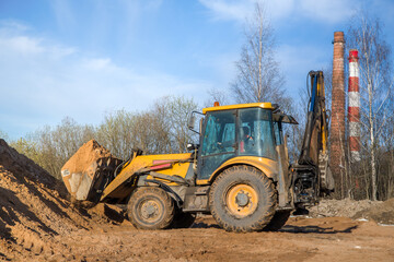 tractor with sand in the bucket on a clear day