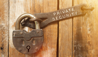 There is a lock on the door on the metal part of which it is written - PRIVATE SECURITY