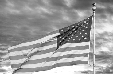 Sunset colors on the background of a waving beautiful american flag