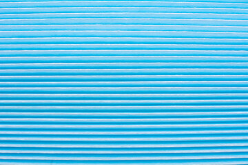 Car air filter close-up background. New spare parts.