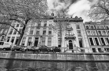 AMSTERDAM, THE NETHERLANDS - APRIL 25, 2015: Traditional houses and buildings on the canal
