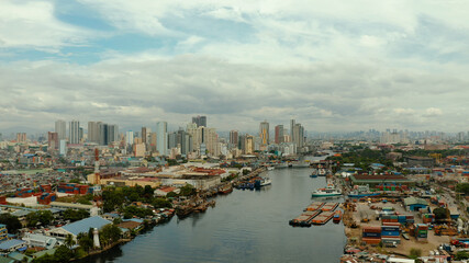 Fototapeta na wymiar Aerial view of Panorama of Manila city. Skyscrapers and business centers in a big city. Travel vacation concept