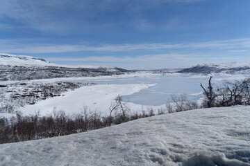 Fototapeta na wymiar View of the frozen lake Sløddfjorden near the village of Haugastøl, in the municipality of Hol, Viken County, Norway, Scandinavia