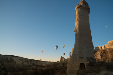 Balloons flying in Cappadocia, Göreme at sunrise. Cappadocia is known around the world as one of the best places to fly with hot air balloons.  Turkey.