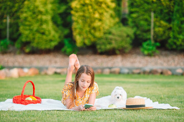 Little smiling girl playing in the park