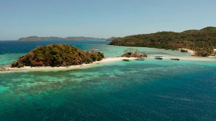 aerial seascape tropical beach with white sand and clear blue sea. tropical landscape with islands and beaches. Philippines, Palawan.