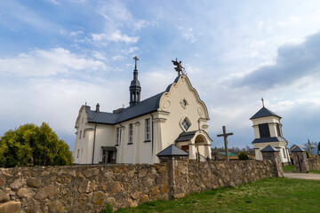 Fototapeta premium The Church of St. Michael the Archangel in the village of Bogdanovo, built in the 20th century in the Art Nouveau style.