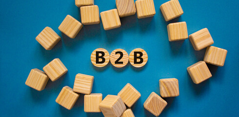 B2B, business to business symbol. Wooden circles with word 'B2B, business to business'. Wooden...