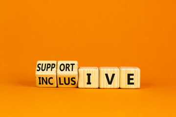Supportive and inclusive symbol. Turned cubes and changed words 'supportive' to 'inclusive'. Beautiful orange background, copy space. Business, supportive and inclusive concept.