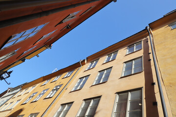 Fototapeta na wymiar Low angle view of buildings along side a narrow street in the Stockholm old town district.